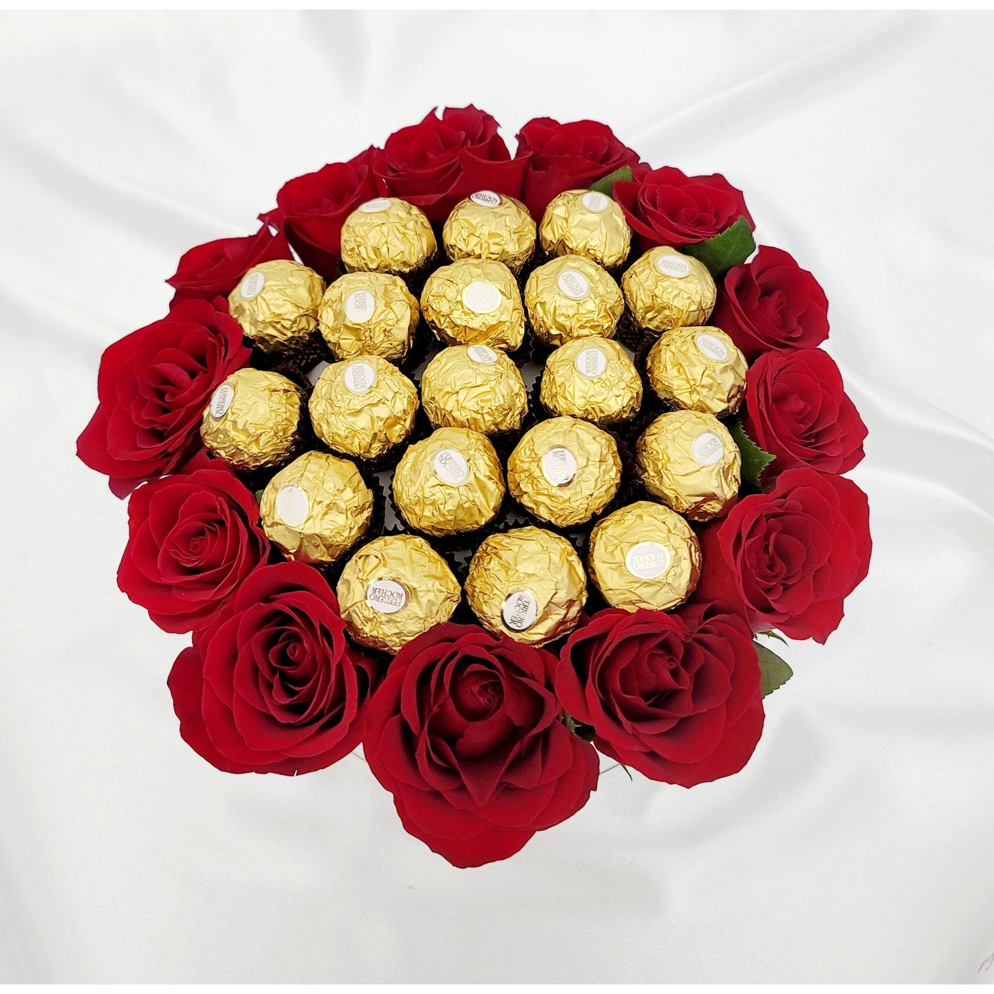 Delight your loved one with our elegant gift box featuring 12 fresh red roses and 20 Ferrero Rocher chocolates. Nestled in a keepsake white gift box.