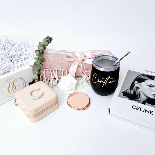Give a thoughtful, personalized gift! Includes a pink throw, custom jewelry box, compact mirror, and engraved wine tumbler. Perfect for any special woman.