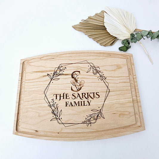 Our personalized cutting board is a testament to quality and craftsmanship. Made from durable cherry wood and engraved with your family name and initial, this board is as functional as it is beautiful. Shipped from our workshop in Montreal, it's a unique piece you'll be proud to own or give.