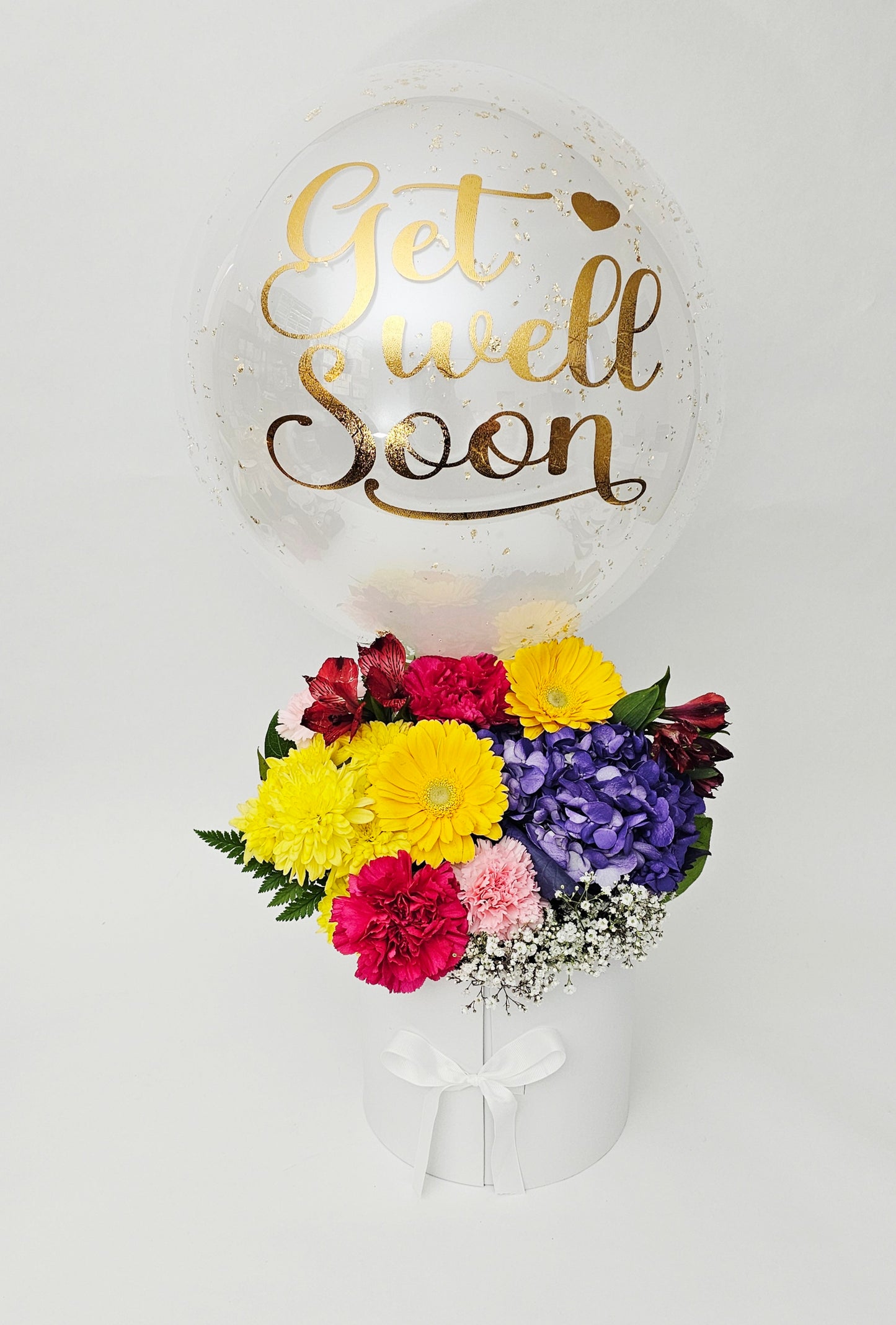 Balloon with 'Get Well Soon' text and a bouquet of flowers on a white background