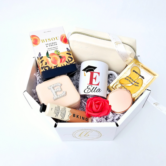 Celebrate their graduation in style with a gift box that embodies glamour and sparkle. This dazzling collection is perfect for the graduate with a taste for the finer things. Unbox a world of shimmering delights, carefully curated to make their special day even more radiant. A sophisticated way to acknowledge their success and wish them a sparkling journey ahead.