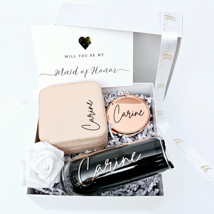 Asking your girls to be part of your big day? Our personalized bridesmaid proposal gift includes a custom name champagne flute, jewelry case, and mirror – a thoughtful way to pop the question!