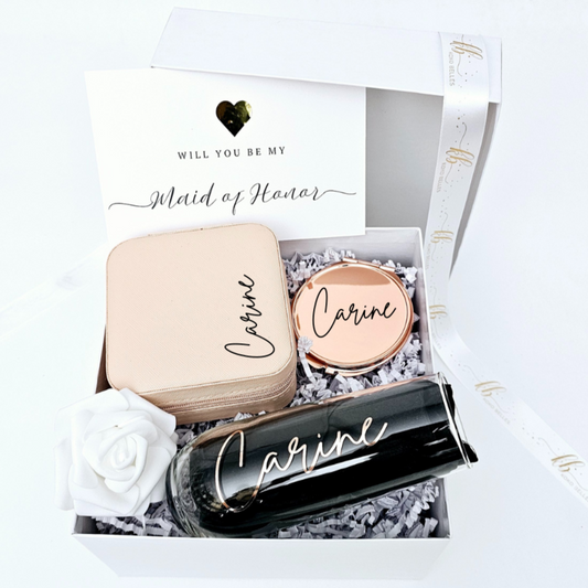 Asking your girls to be part of your big day? Our personalized bridesmaid proposal gift includes a custom name champagne flute, jewelry case, and mirror – a thoughtful way to pop the question!