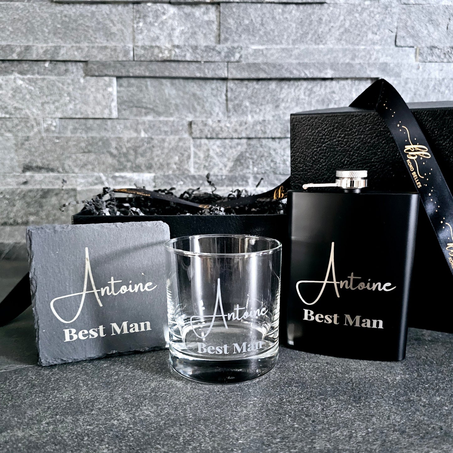 The perfect trio for your groomsmen proposal! This personalized set includes an engraved whiskey glass, stainless steel hip flask, and slate coaster.