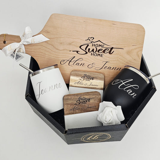 Personalized home gift set with cutting board, tumblers, and coasters