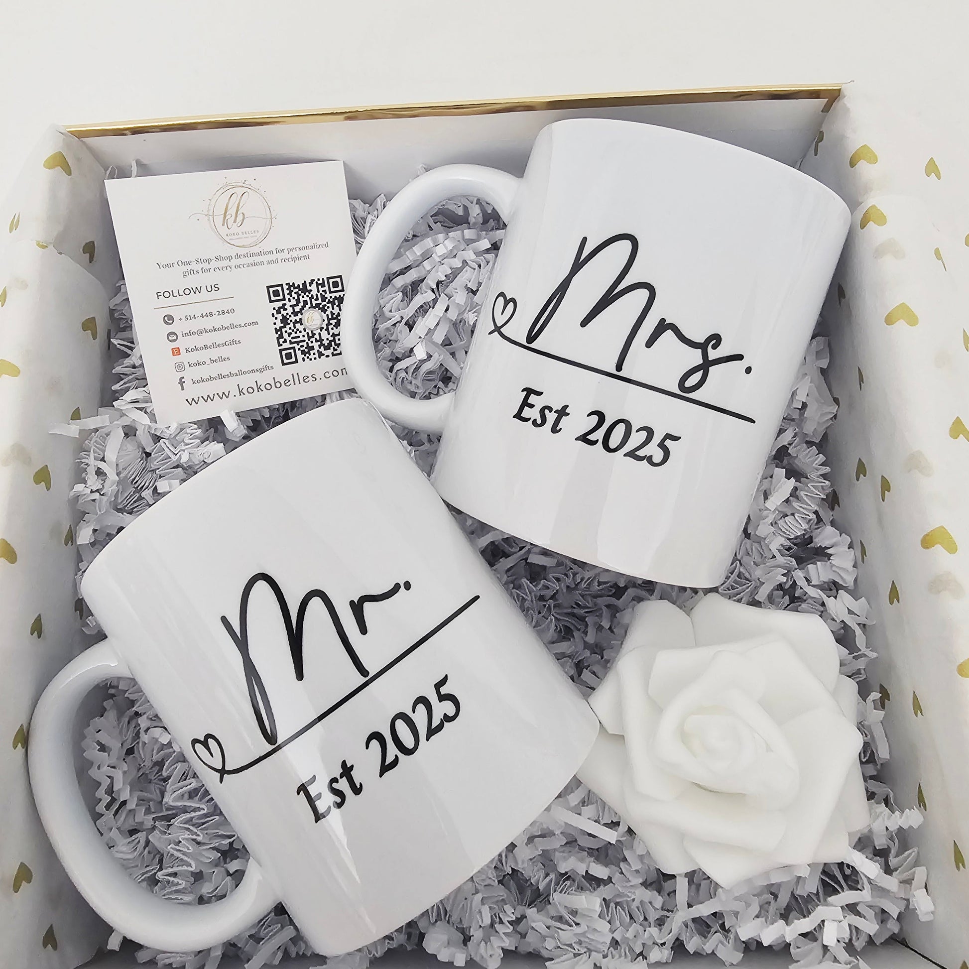 Two white mugs with 'Mr.' and 'Mrs.' text in a white with gold trim box