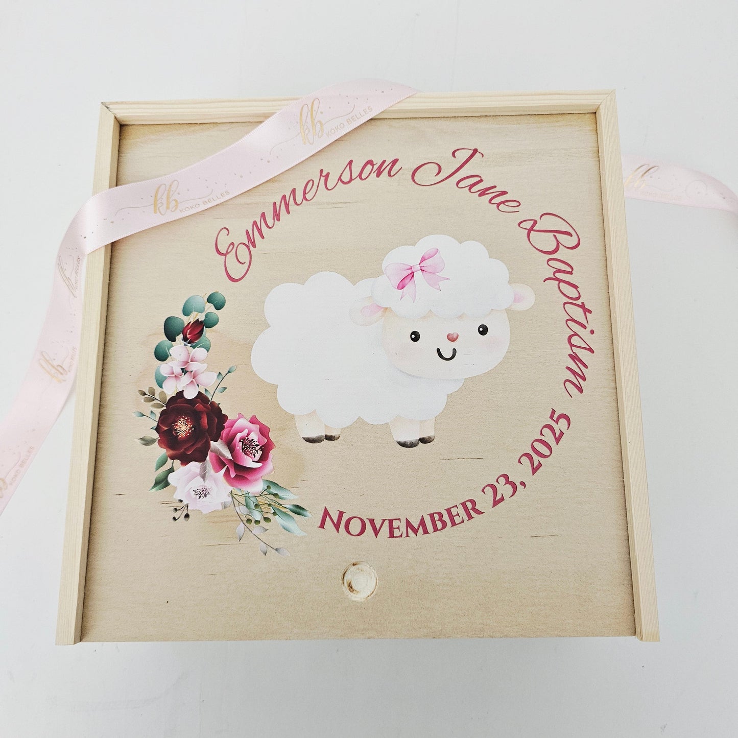 Decorative box with a lamb illustration and floral elements on a white background