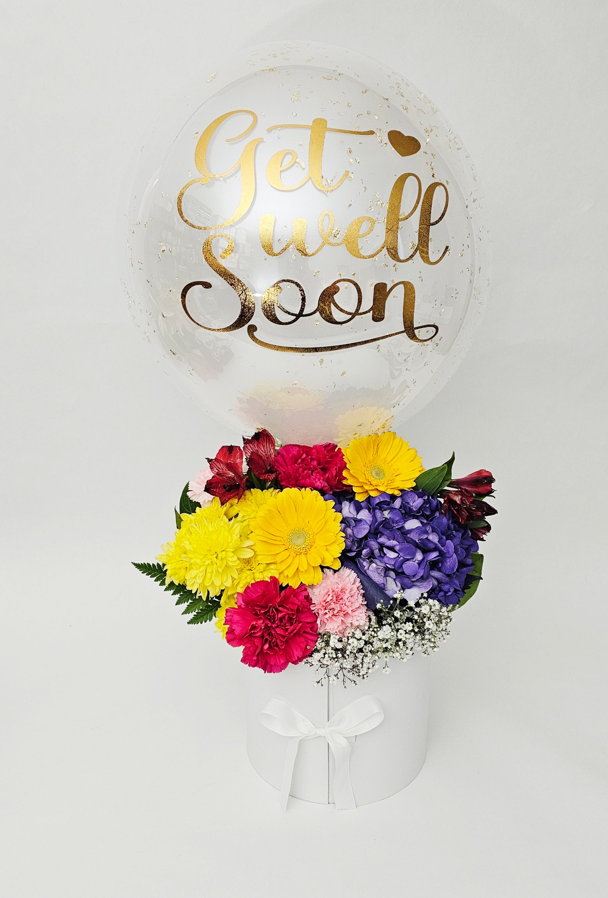 Balloon with 'Get Well Soon' text and a bouquet of flowers on a white background