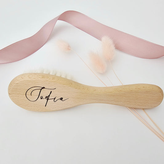 Personalized wooden baby brush with soft bristles engraved with the name Sofia in an elegant script font.