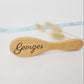 Custom baby hairbrush made of natural wood engraved with the name Georges.