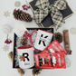 Gift set with personalized mugs and hot chocolate packets on a decorative surface.