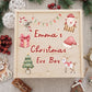 Personalized wooden Christmas Eve box with custom child's name surrounded by watercolor Santa, reindeer, Christmas tree, gift box, and candy cane artwork.