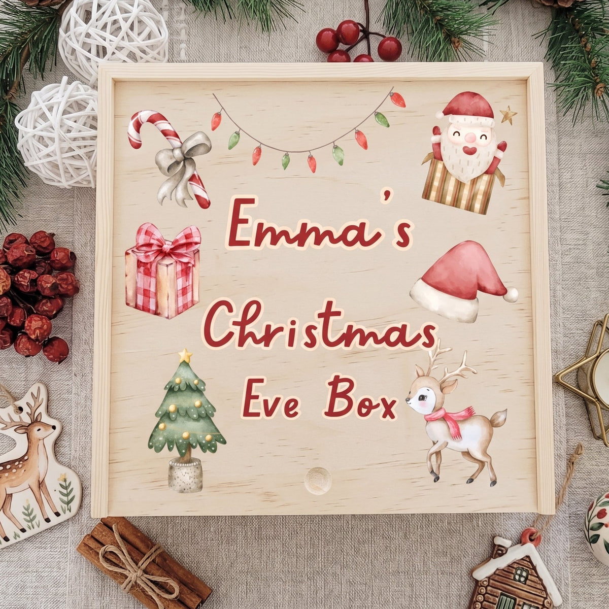 Personalized wooden Christmas Eve box with custom child's name surrounded by watercolor Santa, reindeer, Christmas tree, gift box, and candy cane artwork.