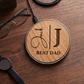 Custom 15W wireless phone charger in cherry wood with a laser-engraved initial and name 