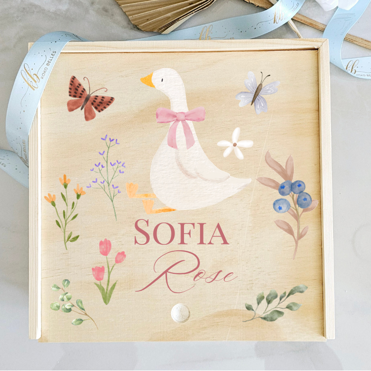 Personalized wooden baby birth announcement box with a watercolor goose, pink floral details, and butterflies.
