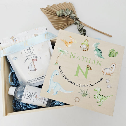 Personalized wooden baby birth announcement box with watercolor T-Rex and Triceratops dinosaurs for a boy.
