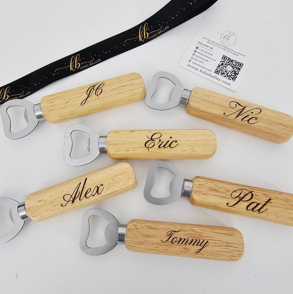 Set of personalized bottle openers with wooden handles on a white background