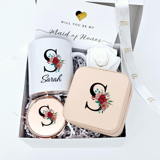 Ask your girls in style with our floral initial bridesmaid gift set. Features a personalized mug, UV printed jewelry case & mirror, a rose, and a sweet proposal card.