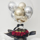 Boîte-cadeau personnalisée avec ballon bulle transparent "Older Hotter Better", mini-ballons or et argent, roses rouges et chocolats Ferrero Rocher.