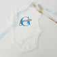 Custom baby boy onesie with bold blue initial G and black script name Georges.