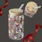 16oz Christmas glass can with wrap-around holiday design next to a top-down view of a bamboo lid featuring a custom laser-engraved curvy name.