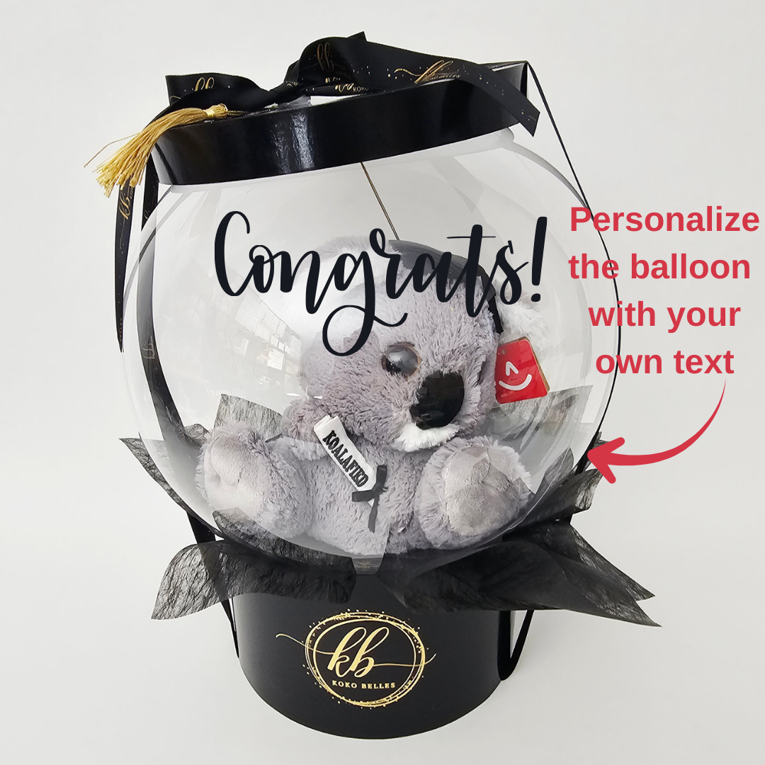 Transparent balloon with a koala toy inside, featuring the word 'Congrats!' and customizable text option.
