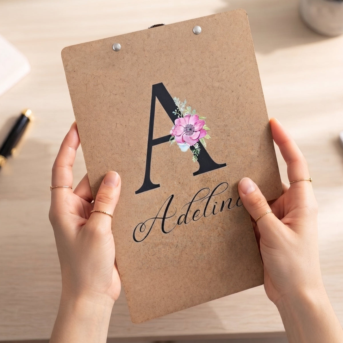 Custom wooden clipboard featuring a UV-printed floral initial A and the name Adeline on the back.